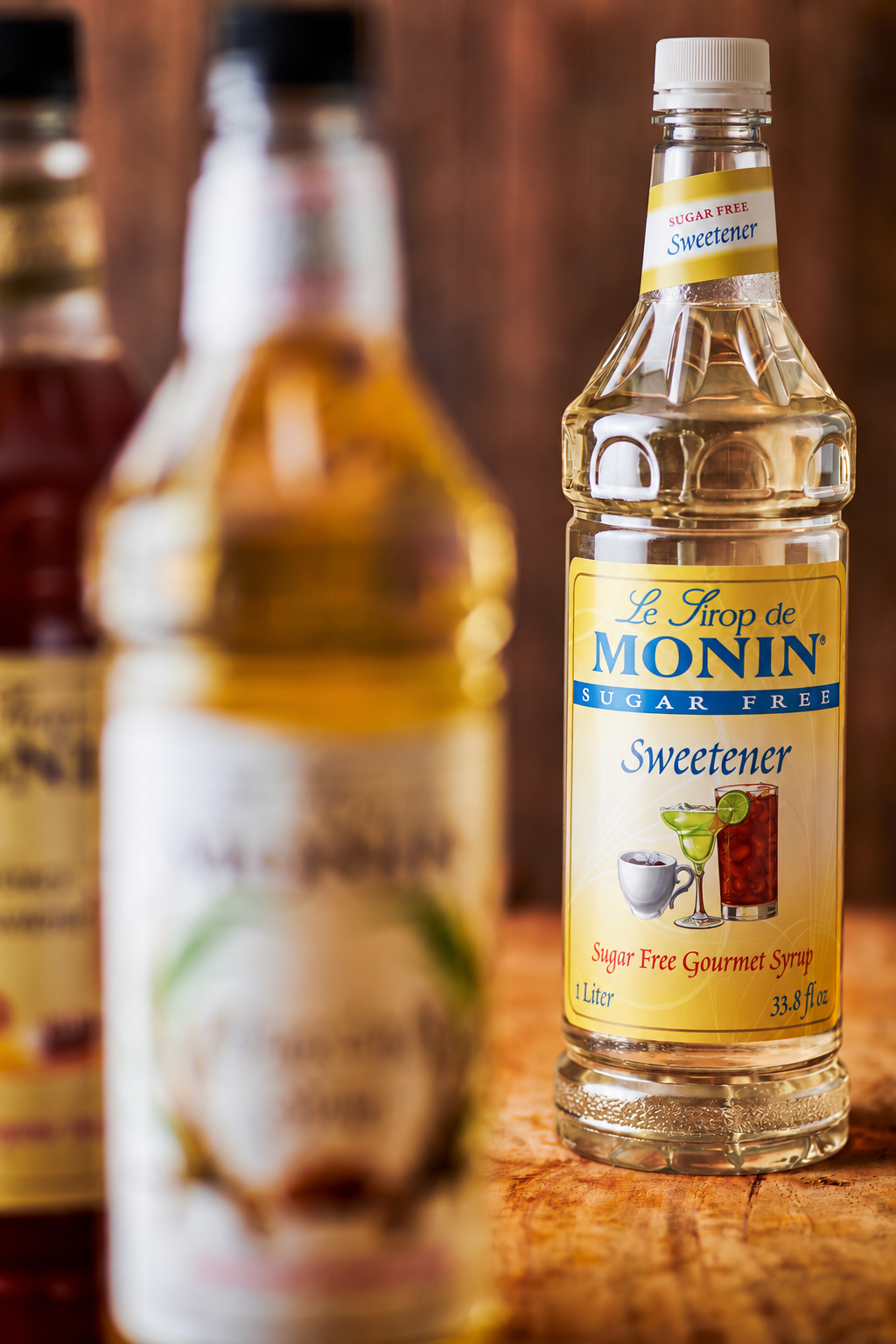 Monin Sugar Free Sweetener bottle displayed with other Monin sweeteners