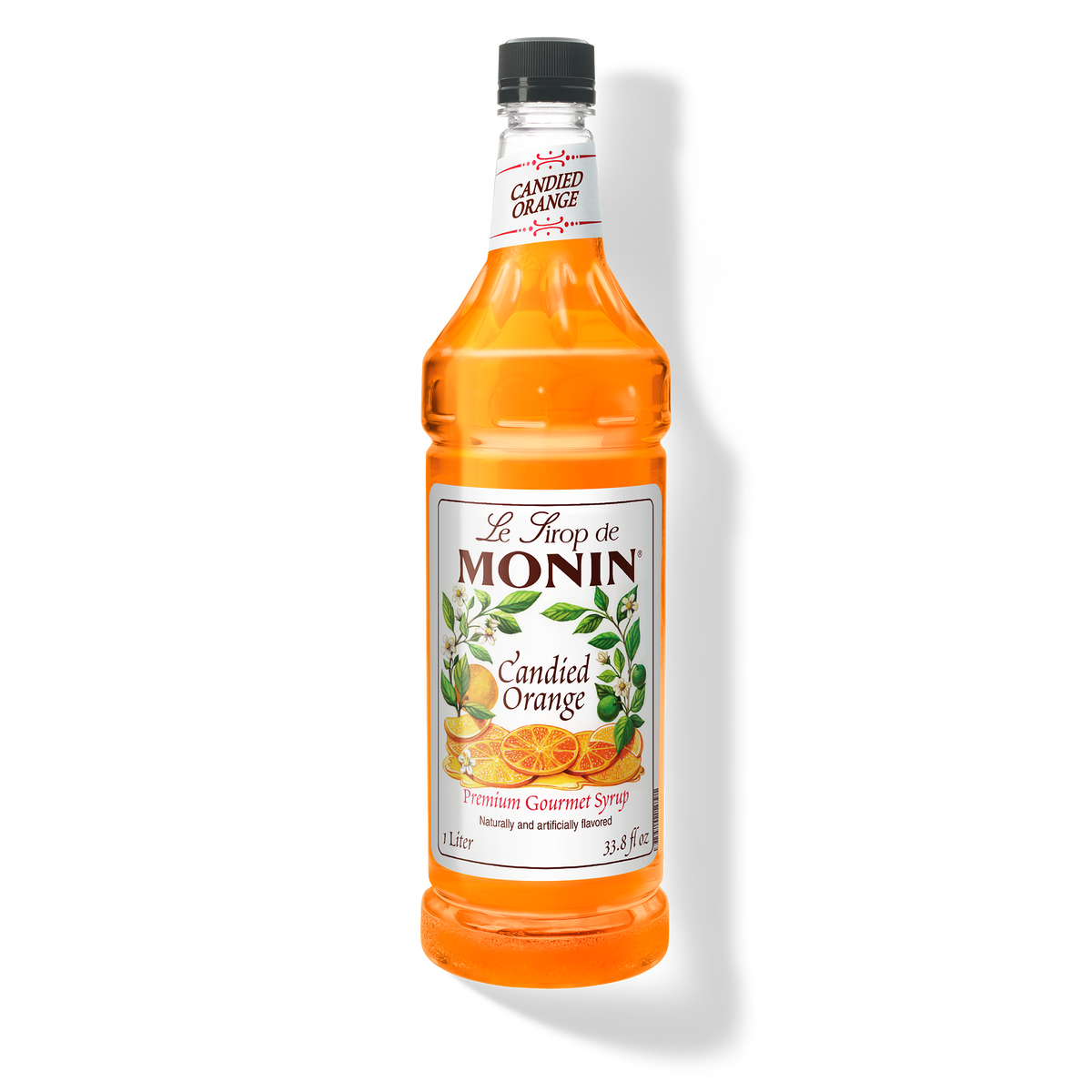 A 1L-bottle of Monin Candied Orange Syrup with a label showing an orange slice and green leaves, indicating the flavor of the syrup.