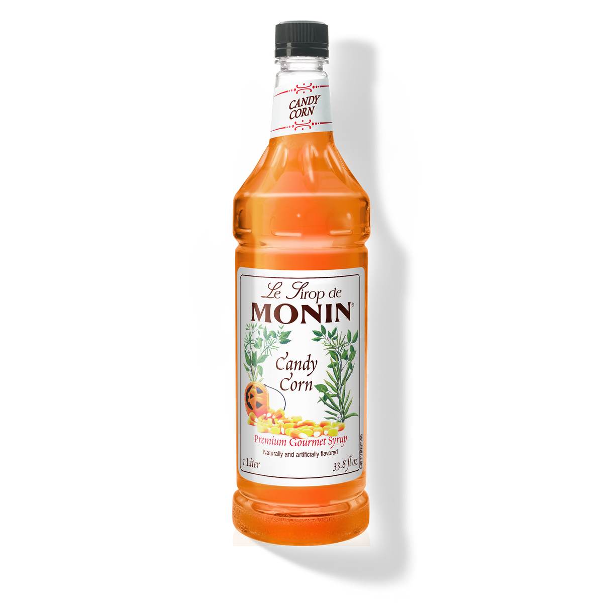 A bottle of Monin Candy Corn Syrup with a label showing the product name and an image of candy corn.