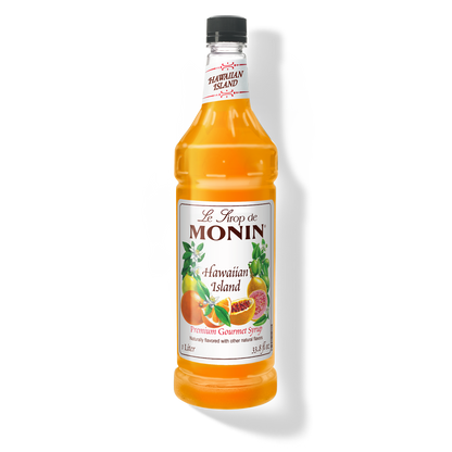 A bottle of Monin Hawaiian Island Syrup with a label showing the brand name and the flavor, placed against a white background.