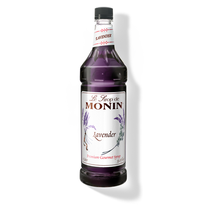 A 1L-bottle of Monin Lavender Syrup with a label showing the brand name and the flavor, placed against a white background.