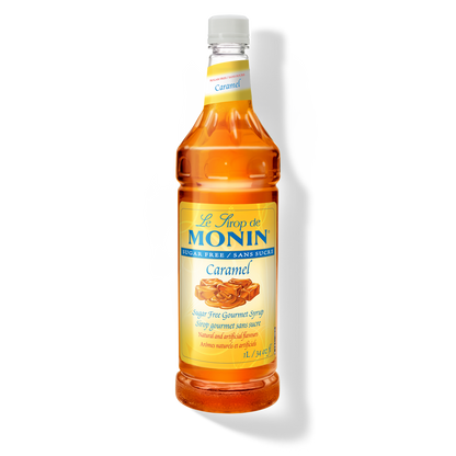 A bottle of Monin Sugar Free Caramel Syrup with a label showing a piece of caramel candy
