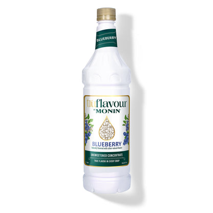 Monin Blueberry syrup bottle on a white background