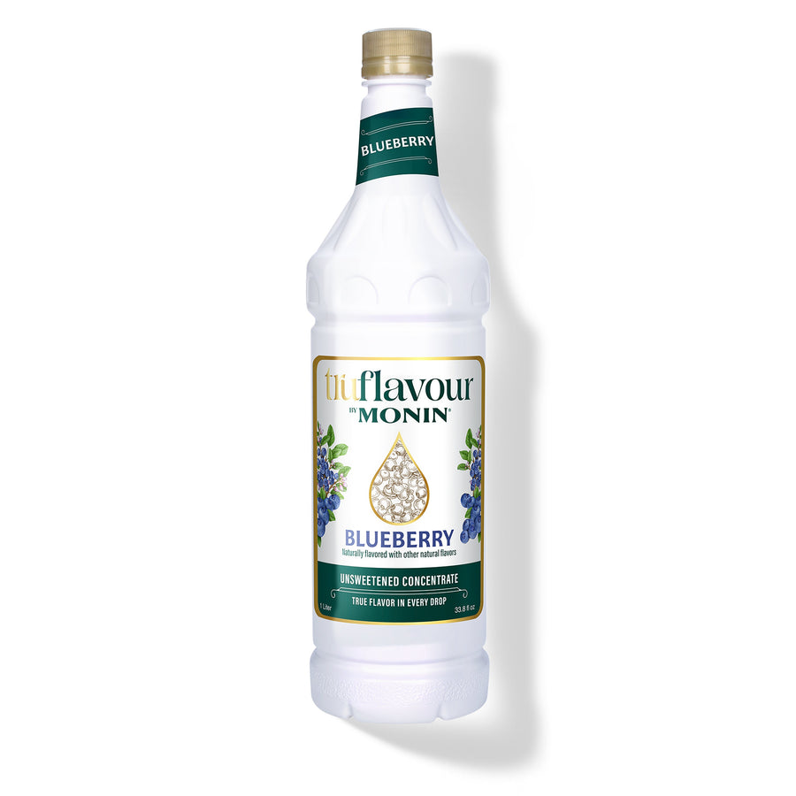 Monin Blueberry syrup bottle on a white background