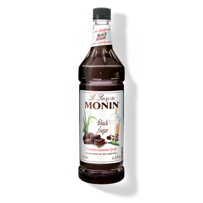 A bottle of Monin Black Sugar Syrup, with a label showing the brand name and the syrup's name.