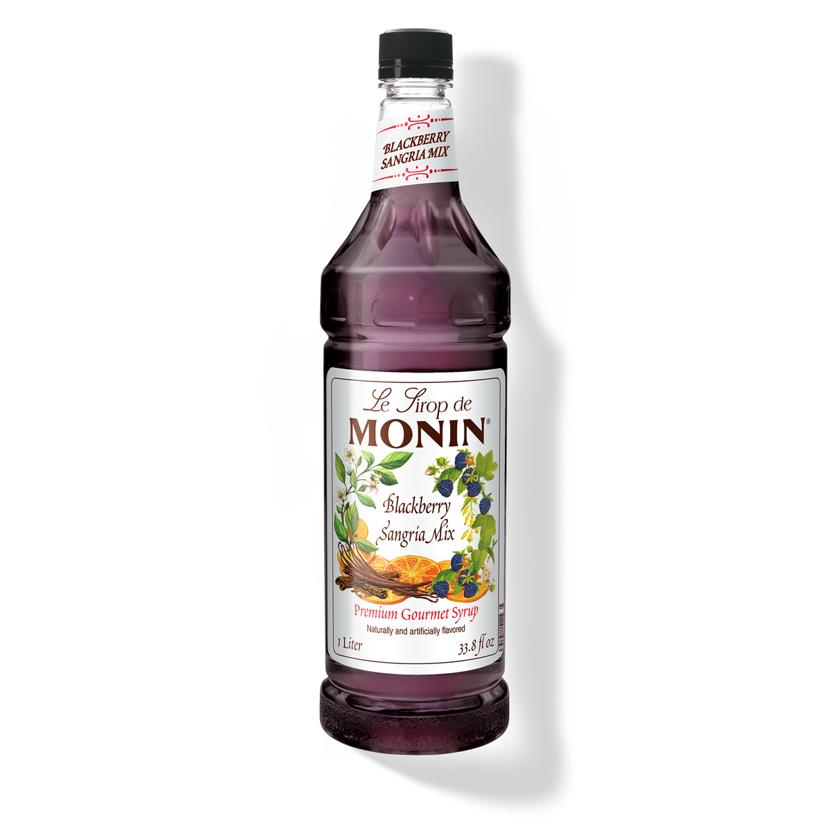 A bottle of Monin Blackberry Sangria Mix with a label showing a picture of blackberries and text indicating the flavor.