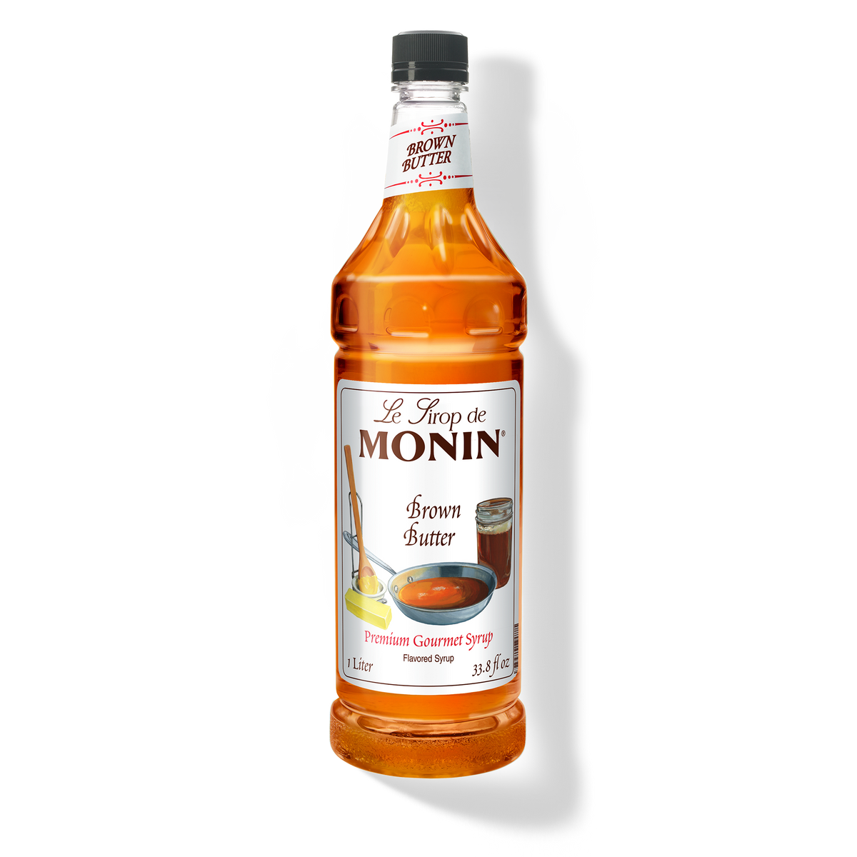 A 1L-bottle of Monin Brown Butter Syrup with a label showing the product name and the flavour