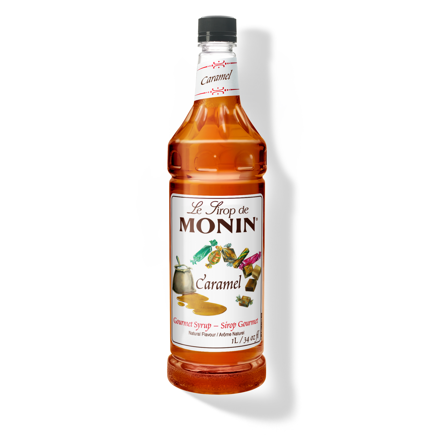 A bottle of Monin caramel syrup on a plain white background. The clear bottle shows the amber liquid inside and has a white label with the brand name.
