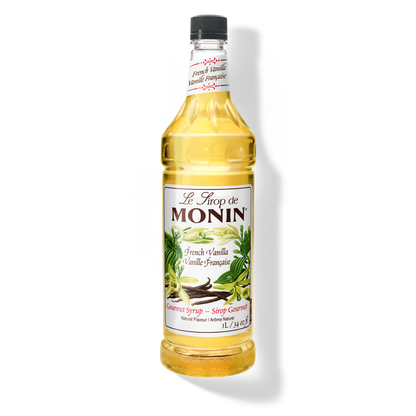 A 1L-bottle of Monin French Vanilla Syrup with a label showing the brand name and the flavor, placed against a white background.
