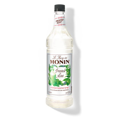 A 1L bottle of Monin Frosted Mint Syrup with a label showing the brand name and the flavor, placed against a white background.
