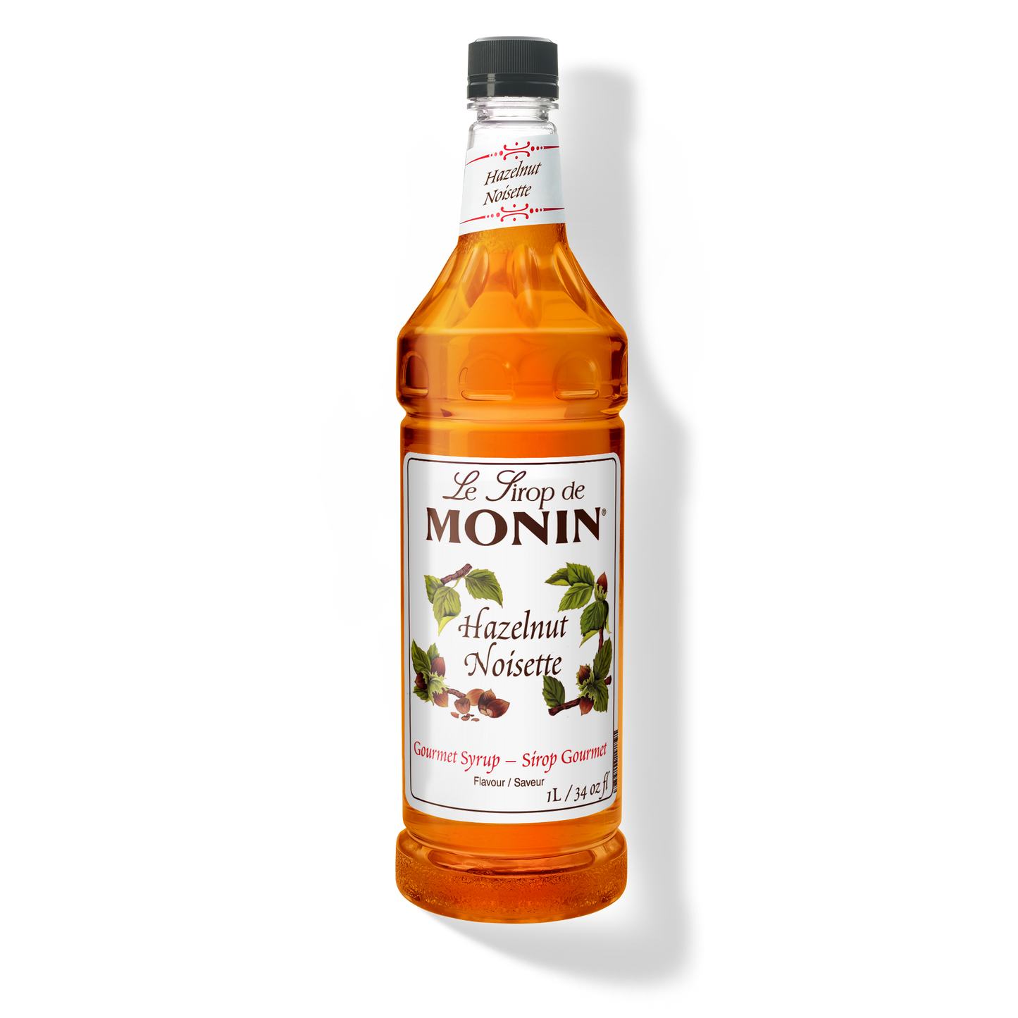 A 1L-bottle of Monin Hazelnut Syrup with a label showing the brand name and the flavor, placed against a white background.