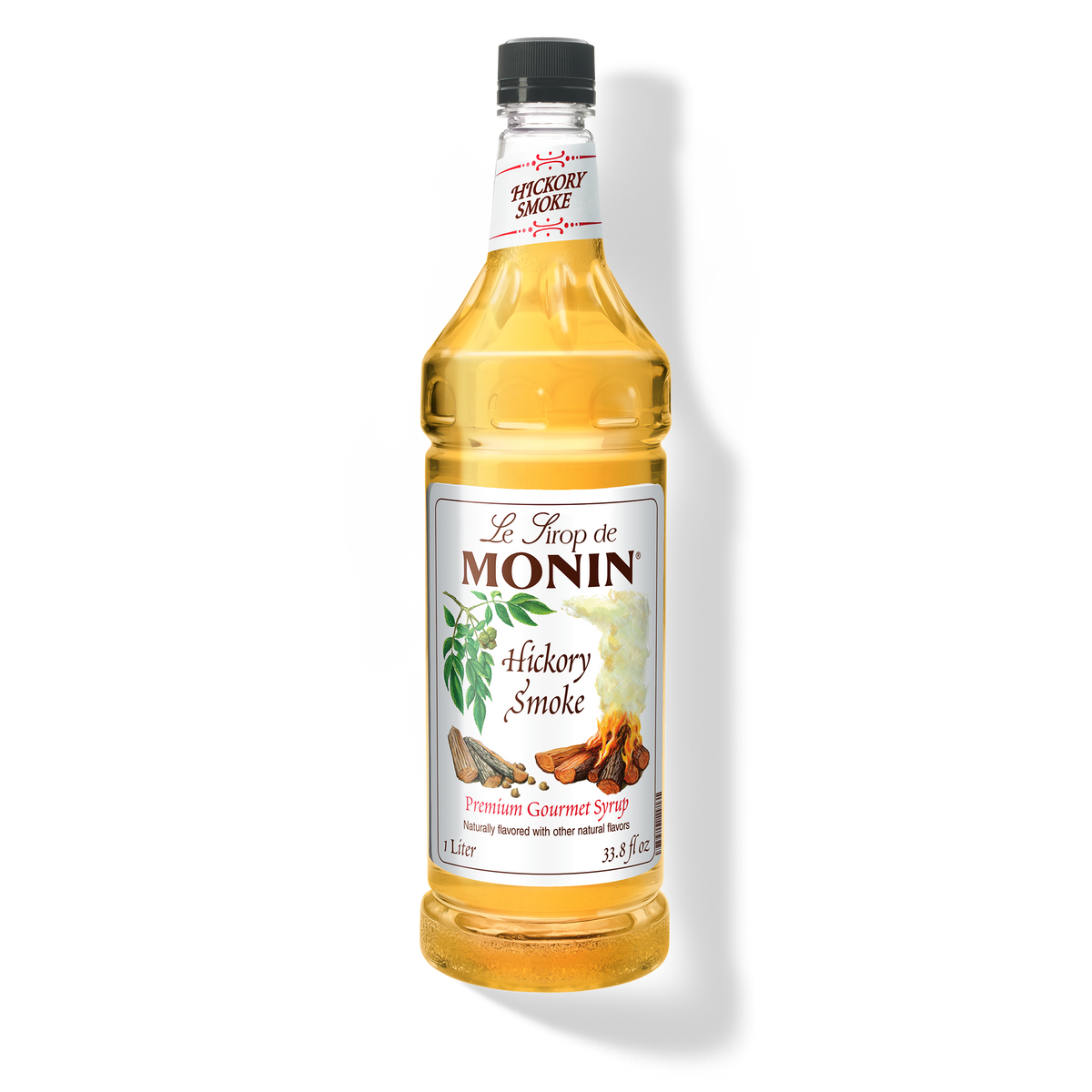 A 1L-bottle of Monin Hickory Smoke Syrup with a label showing the brand name and the flavor, placed against a white background.
