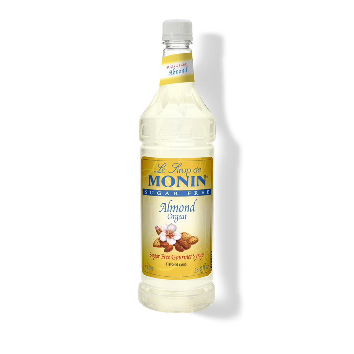 A bottle of Monin Sugar Free Almond (Orgeat) Syrup, with a label showing almonds and text.