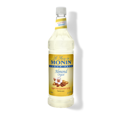 A bottle of Monin Sugar Free Almond (Orgeat) Syrup, with a label showing almonds and text.