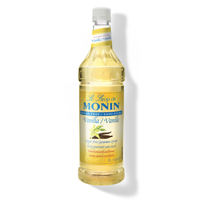 A bottle of Monin Sugar Free Vanilla Syrup with a label showing the brand name and the flavor, placed against a white background.