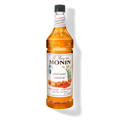 A 1L-bottle of Monin Salted Caramel Syrup with a label showing the brand name and the flavor, placed against a white background.