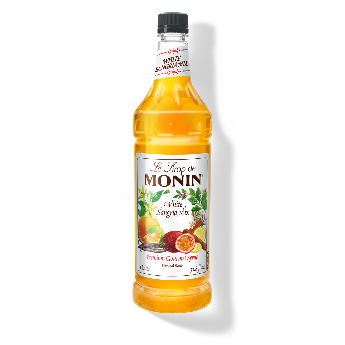 A bottle of Monin White Sangria Mix Syrup with a label showing the brand name and the flavor, placed against a white background.
