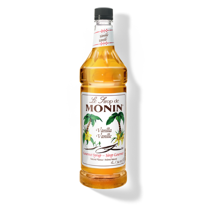 A 1L-bottle of Monin Strawberry Syrup with a label showing the brand name and the flavor, placed against a white background.