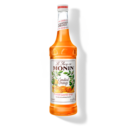 A 750mL-bottle of Monin Candied Orange Syrup with a label showing an orange slice and green leaves, indicating the flavor of the syrup.