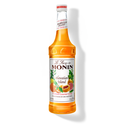 A bottle of Monin Hawaiian Island Syrup with a label showing the brand name and the flavor, placed against a white background.