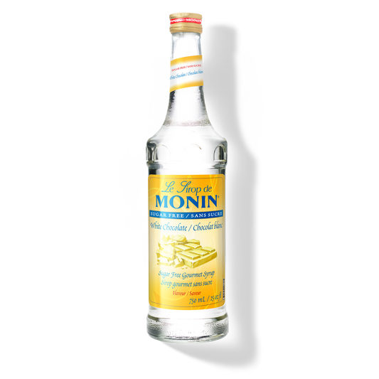 A bottle of Monin Sugar Free White Chocolate Syrup, with a label showing the brand name and the flavor, against a white background.