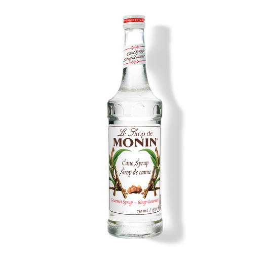 A 750mL-bottle of Monin Pure Cane Sugar Syrup with a label showing the brand name and the flavor, placed against a white background.