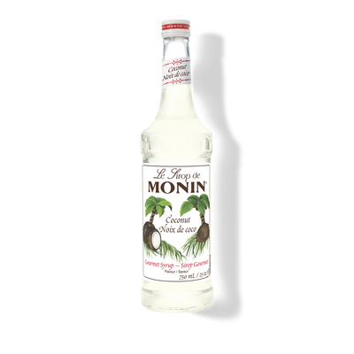 A bottle of Monin Coconut Syrup (Nôux de coco) on a white background with a soft shadow.