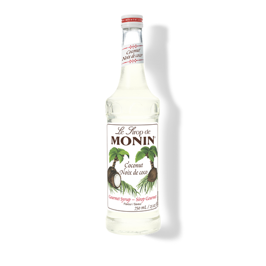 A bottle of Monin Coconut Syrup (Nôux de coco) on a white background with a soft shadow.