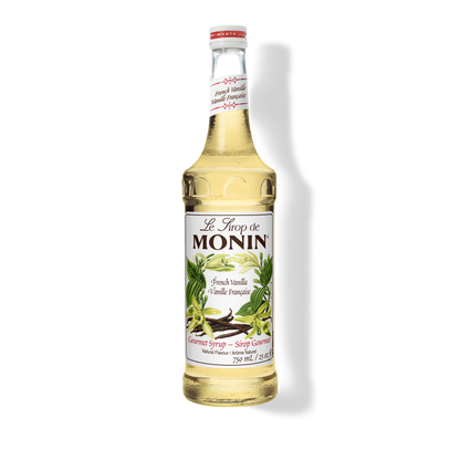 A bottle of Monin French Vanilla Syrup with a label showing the brand name and the flavor, placed against a white background.