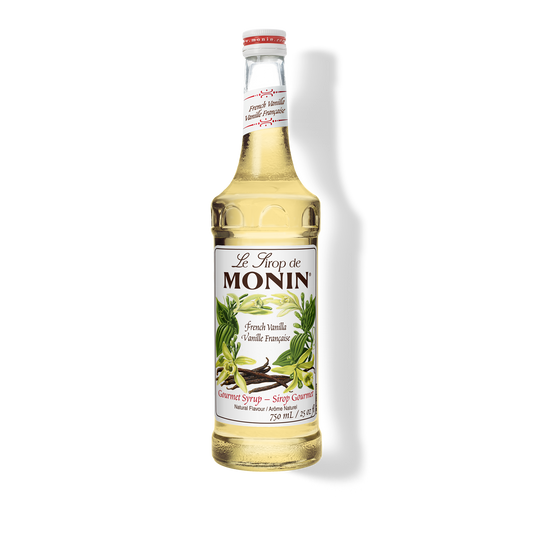 A bottle of Monin French Vanilla Syrup with a label showing the brand name and the flavor, placed against a white background.