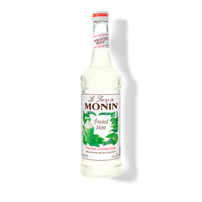 A bottle of Monin Frosted Mint Syrup with a label showing the brand name and the flavor, placed against a white background.