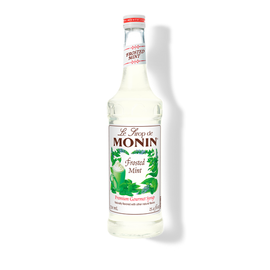 A bottle of Monin Frosted Mint Syrup with a label showing the brand name and the flavor, placed against a white background.