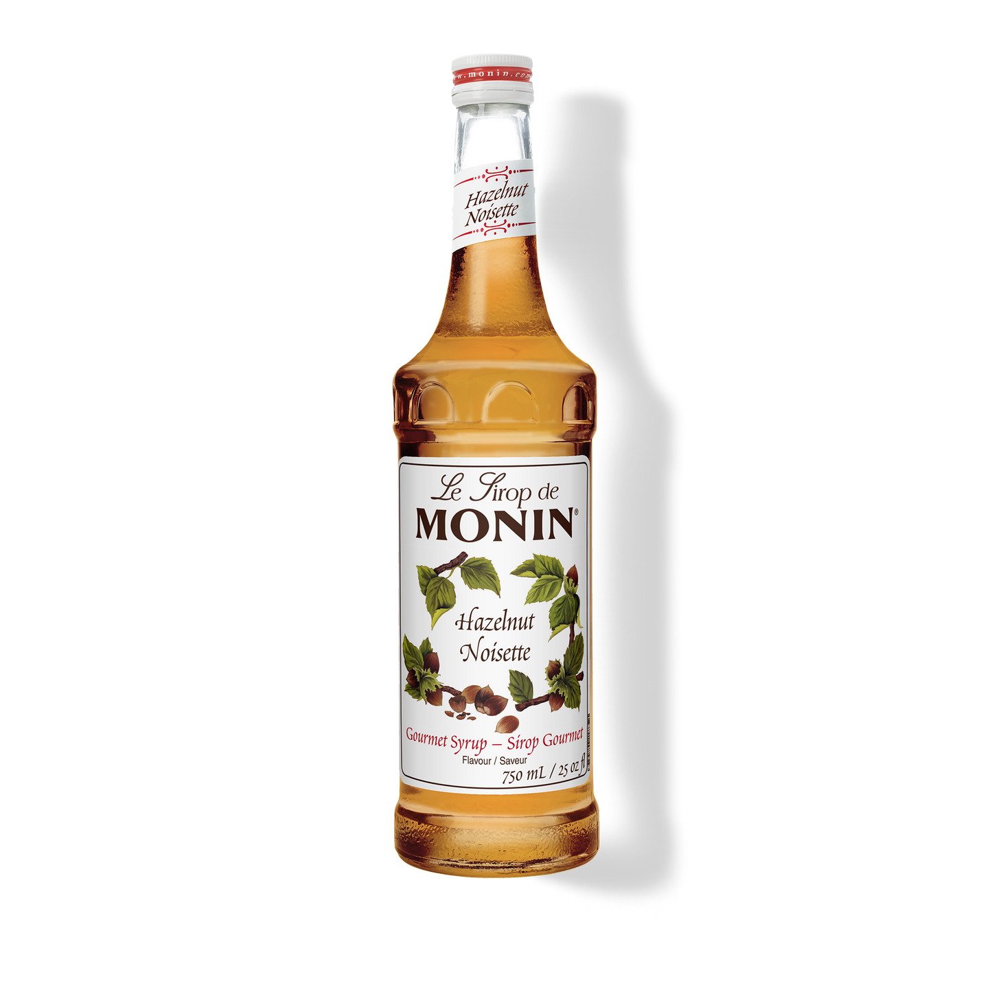 A 750mL-bottle of Monin Hazelnut Syrup with a label showing the brand name and the flavor, placed against a white background.