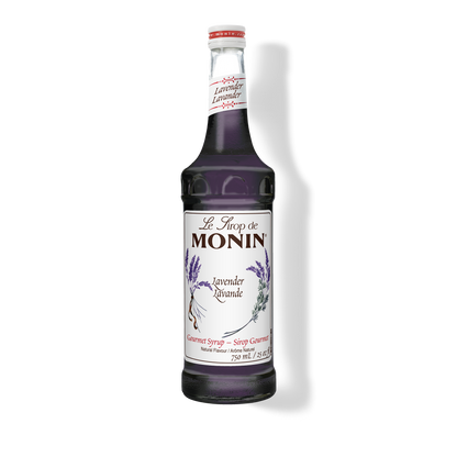 A bottle of Monin Lavender Syrup with a label showing the brand name and the flavor, placed against a white background.