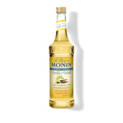 A 750mL-bottle of Monin Sugar Free Vanilla Syrup with a label showing the brand name and the flavor, placed against a white background.