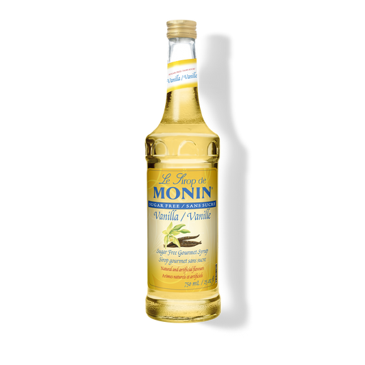 A 750mL-bottle of Monin Sugar Free Vanilla Syrup with a label showing the brand name and the flavor, placed against a white background.