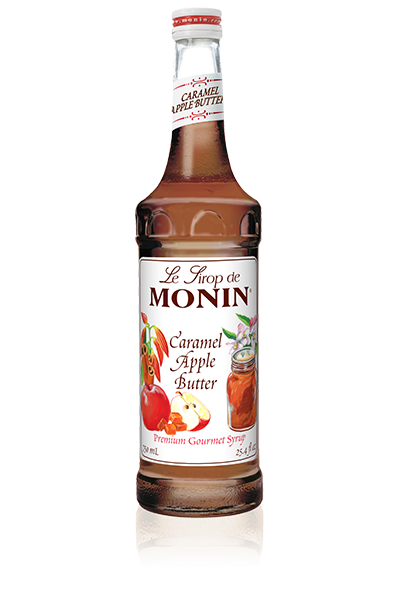 A 750mL-bottle of Monin Caramel Apple Butter Syrup with a label showing an image of an apple and cinnamon spice, indicating the flavor of the syrup.