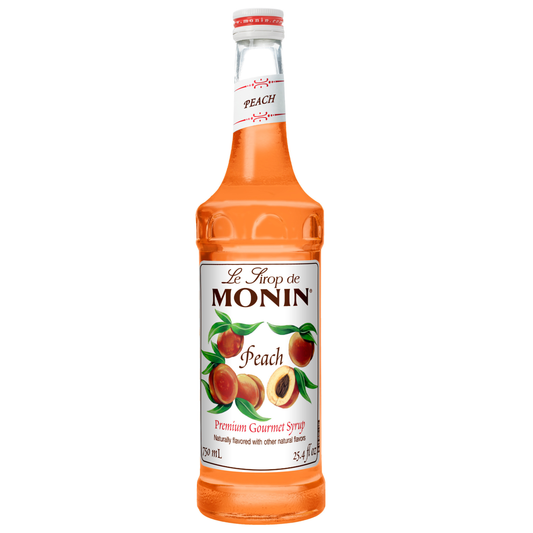 Monin Peach syrup bottle on a white background