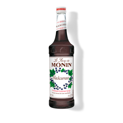 A bottle of Monin Blackcurrant Syrup with a label showing the brand name and the flavor, set against a white background.
