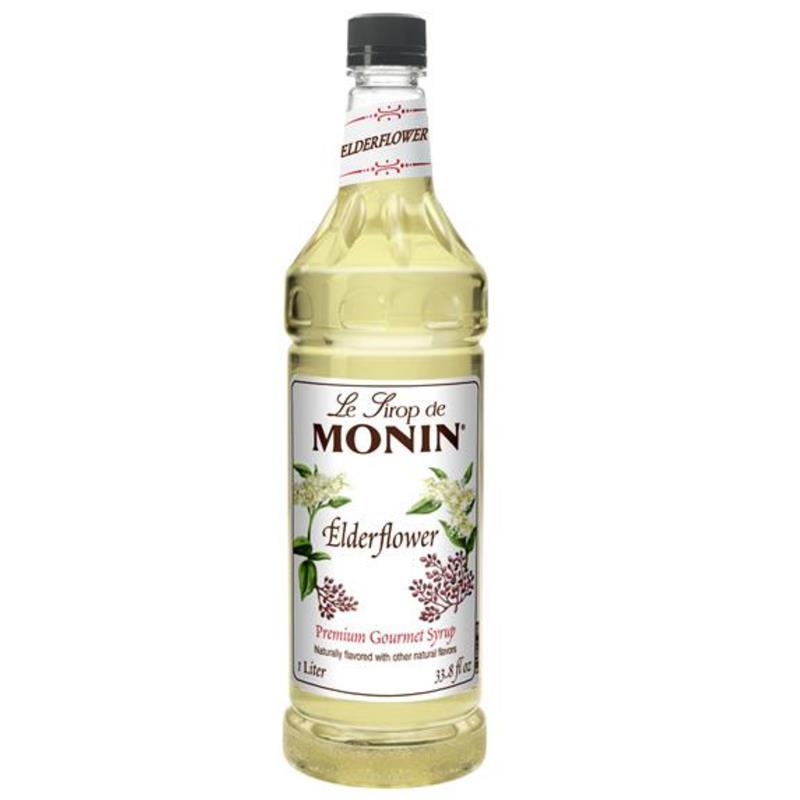 Bottle of Monin Elderflower syrup on a white background