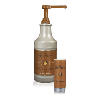 A bottle of Monin Dulce de Leche Sauce beside a 12oz squeeze bottle of the flavour.