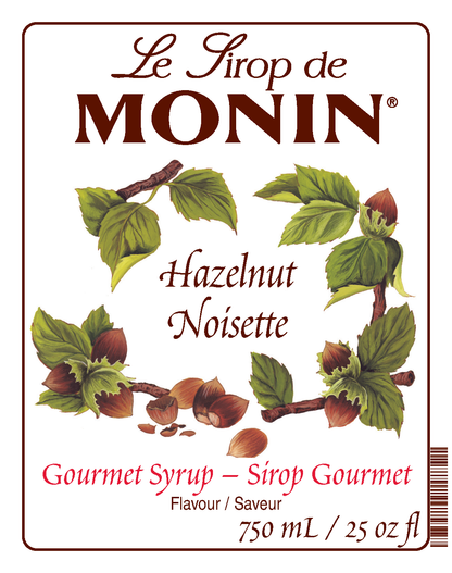 A 750mL bottle label of Monin Hazelnut Syrup (Noisette), featuring the brand name and flavour, placed against a white background