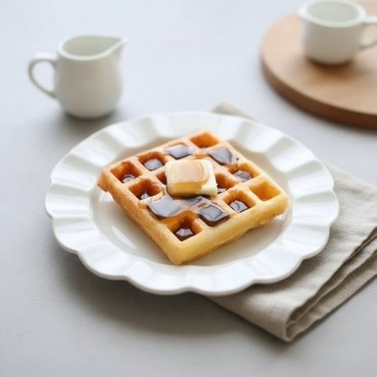Maple Pancake Butter served on a golden waffle with maple syrup, plated for breakfast on a white dish.