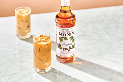 Monin Hazelnut Syrup with a creamy hazelnut coffee, highlighting rich, nutty flavour for lattes, coffees and specialty drinks.
