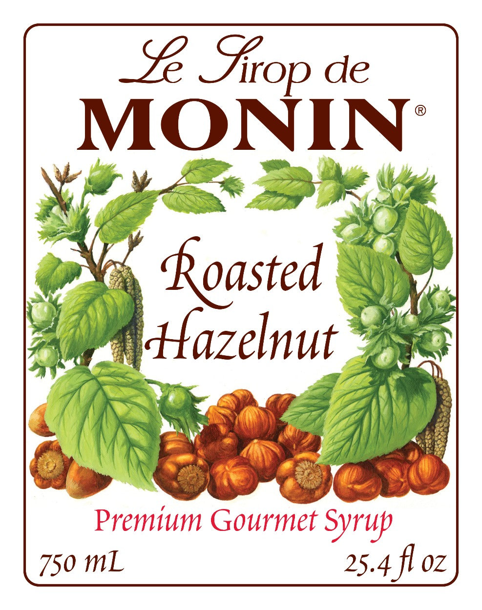 750mL Monin Roasted Hazelnut Syrup label showing the brand name and hazelnut illustrations.