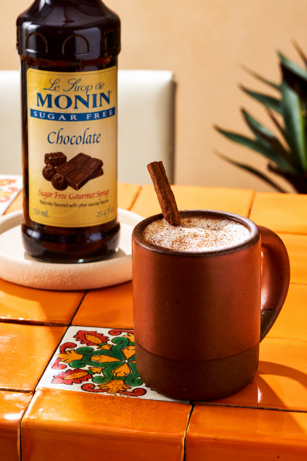 Monin Sugar Free Chocolate Syrup with hot chocolate and cinnamon stick